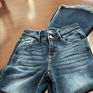 KanCan jeans. Frayed hem with slit on side